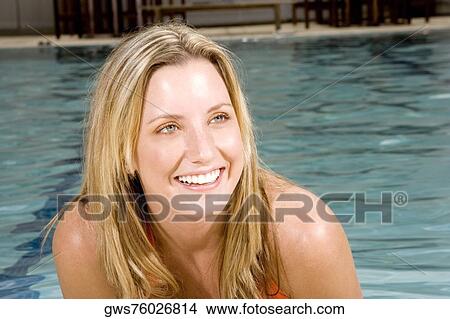 Close-up of a young woman smiling View Large Photo Image Picture - Close-up of a young woman smiling. Fotosearch