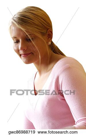 Close-up of a young woman smirking View Large Photo Image Stock Photo - Close-up of a young woman smirking. Fotosearch
