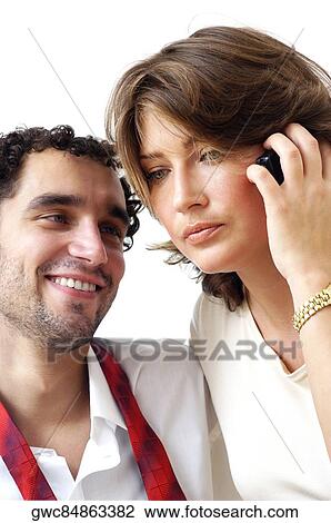 Close-up of a young woman talking on a mobile phone View Large Photo Image Stock Image - Close-up of a young woman talking on a mobile phone. Fotosearch