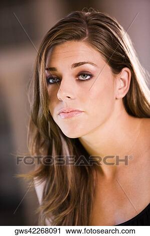 Close-up of a young woman thinking View Large Photo Image Stock Image - Close-up of a young woman thinking. Fotosearch