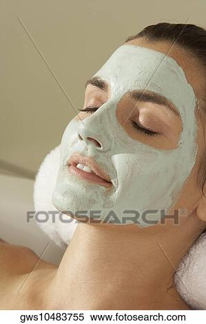 Close-up of a young woman wearing a facial mask View Large Photo Image Stock Photography - Close-up of a young woman wearing a facial mask. Fotosearch