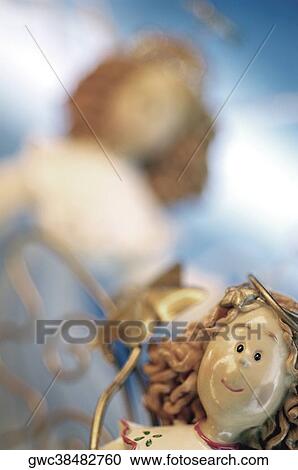 Stock Image - Close-up of an angel figurine. Fotosearch
