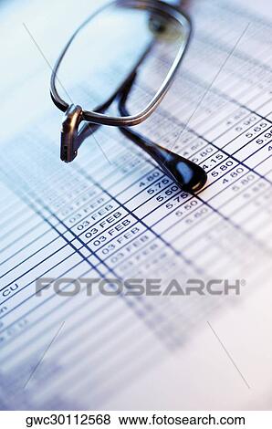 Close-up of eyeglasses on a financial page View Large Photo Image Stock Photo - Close-up of eyeglasses on a financial page. Fotosearch