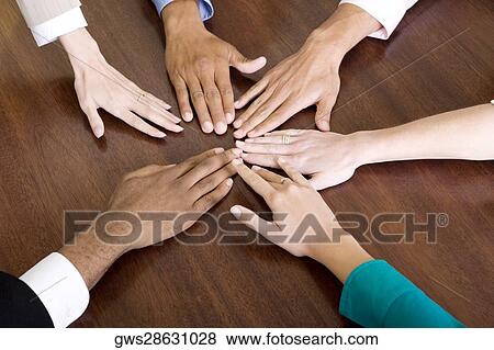 Stock Photo - Close-up of human hands on a table. Fotosearch