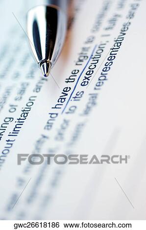 Stock Photograph - Close-up of pen on a printed document. Fotosearch