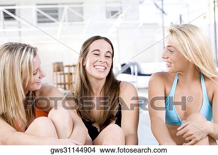 Close-up of three young women smiling View Large Photo Image Picture - Close-up of three young women smiling. Fotosearch