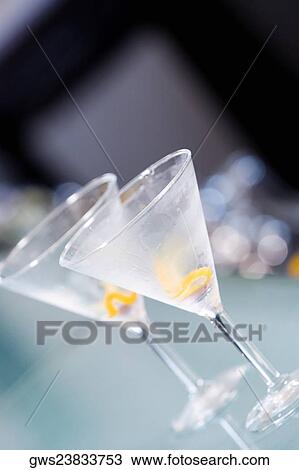 Stock Image - Close-up of two empty martini glasses. Fotosearch