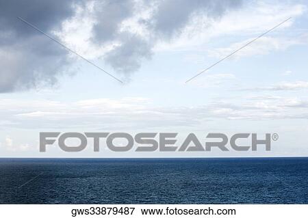 Stock Photo - Clouds over the sea. Fotosearch