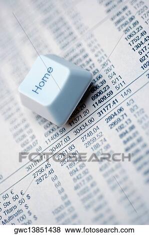 Computer key on a financial page View Large Photo Image Stock Photo - Computer key on a financial page. Fotosearch