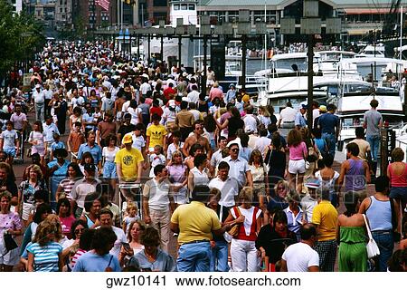 Stock Image - Crowds of people on the street in Baltimore, Maryland. Fotosearch
