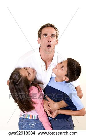 Father lifting his son and daughter View Large Photo Image Picture - Father lifting his son and daughter. Fotosearch