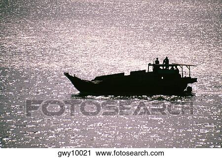 Stock Image - Fishing boat in the Saigon River Delta, Vietnam. Fotosearch