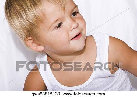 High angle view of a boy thinking View Large Photo Image Stock Image - High angle view of a boy thinking. Fotosearch