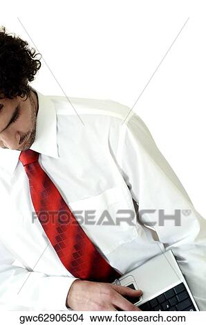 High angle view of a businessman using a laptop View Large Photo Image Picture - High angle view of a businessman using a laptop. Fotosearch
