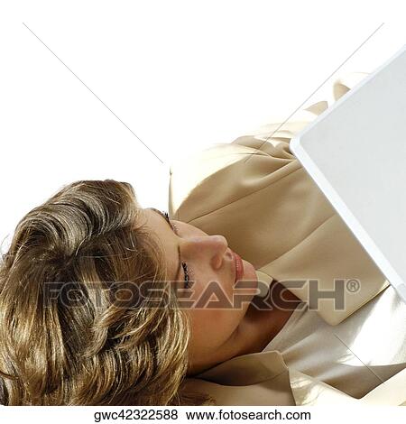 High angle view of a businesswoman in front of a laptop View Large Photo Image Stock Photo - High angle view of a businesswoman in front of a laptop. Fotosearch
