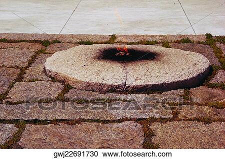 High angle view of a flame on a grave, Arlington National Cemetery, Arlington, Virginia, USA View Large Photo Image Stock Image - High angle view of a flame on a grave, Arlington National Cemetery, Arlington, Virginia, USA. Fotosearch