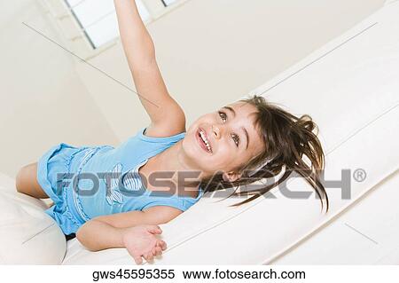 High angle view of a girl lying on the bed View Large Photo Image Stock Photography - High angle view of a girl lying on the bed. Fotosearch