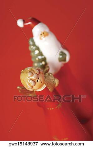 High angle view of a Santa Claus and an angel figurine View Large Photo Image Stock Photo - High angle view of a Santa Claus and an angel figurine. Fotosearch