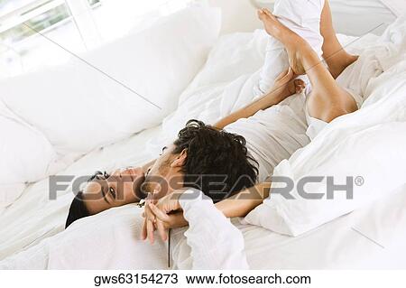High angle view of a young man kissing a young woman View Large Photo Image Stock Image - High angle view of a young man kissing a young woman. Fotosearch