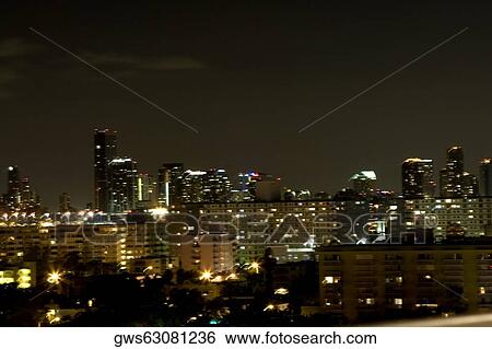 High angle view of buildings lit up at night View Large Photo Image Stock Photograph - High angle view of buildings lit up at night. Fotosearch