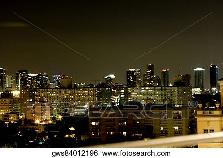 High angle view of buildings lit up at night View Large Photo Image Stock Photograph - High angle view of buildings lit up at night. Fotosearch