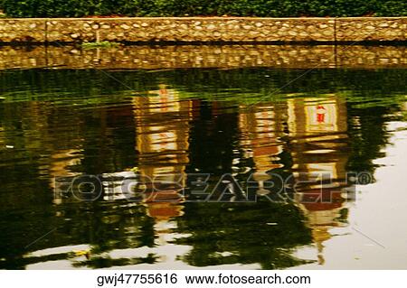 High angle view of the reflection of a building in a water View Large Photo Image Stock Photograph - High angle view of the reflection of a building in a water. Fotosearch