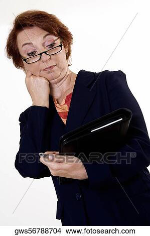 Low angle view of a businesswoman holding a pen View Large Photo Image Picture - Low angle view of a businesswoman holding a pen. Fotosearch