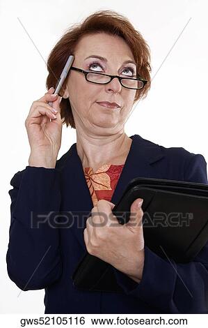 Stock Photograph - Low angle view of a businesswoman holding a file and a pen. Fotosearch