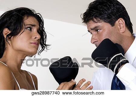Low angle view of a mid adult man punching a young woman View Large Photo Image Stock Image - Low angle view of a mid adult man punching a young woman. Fotosearch