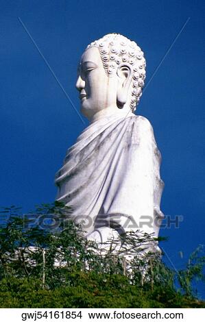Low angle view of a statue of Buddha View Large Photo Image Picture - Low angle view of a statue of Buddha. Fotosearch