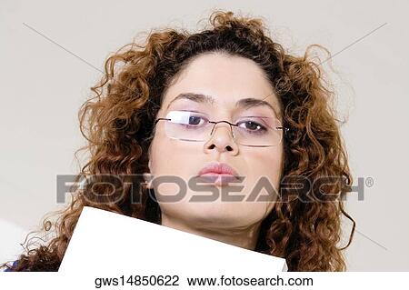 Low angle view of a young woman's face View Large Photo Image Stock Image - Low angle view of a young woman's face. Fotosearch