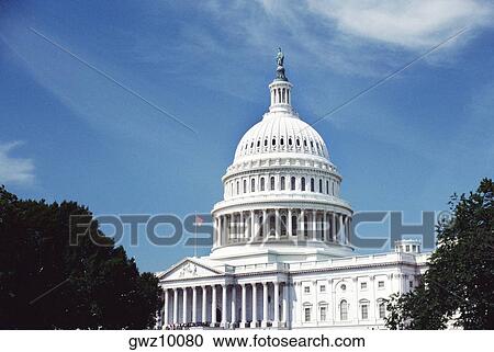 Low angle view of an American flag on a government building, Capitol Building, Washington DC, USA View Large Photo Image Stock Image - Low angle view of an American flag on a government building, Capitol Building, Washington DC, USA. Fotosearch