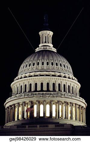 Low angle view of an American flag on a government building, Capitol Building, Washington DC, USA View Large Photo Image Stock Photo - Low angle view of an American flag on a government building, Capitol Building, Washington DC, USA. Fotosearch