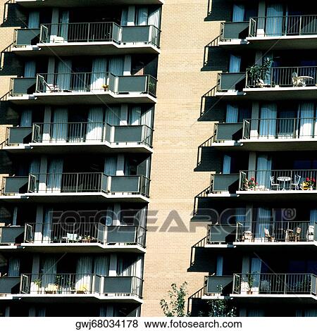 Low angle view of balconies of a residential building View Large Photo Image Stock Photo - Low angle view of balconies of a residential building. Fotosearch