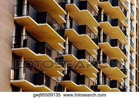 Low angle view of balconies of a building View Large Photo Image Stock Photography - Low angle view of balconies of a building. Fotosearch