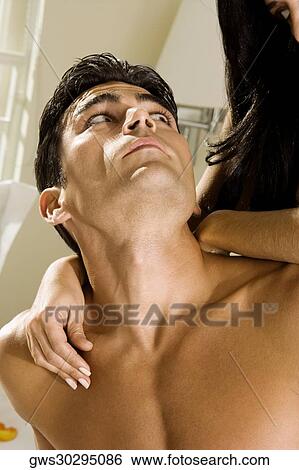 Mid adult couple looking at each other on the bed View Large Photo Image Stock Photograph - Mid adult couple looking at each other on the bed. Fotosearch