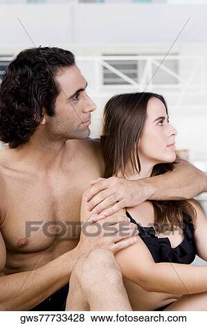 Mid adult man and a young woman looking sideways View Large Photo Image Stock Photo - Mid adult man and a young woman looking sideways. Fotosearch