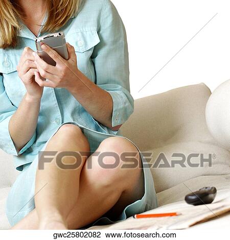 Mid section view of a businesswoman operating a personal data assistant View Large Photo Image Stock Image - Mid section view of a businesswoman operating a personal data assistant. Fotosearch