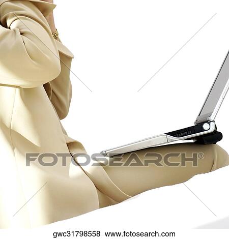 Stock Photo - Mid section view of a businesswoman sitting with a laptop. Fotosearch