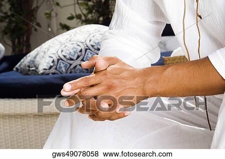 Mid section view of a mid adult man with his hands clasped View Large Photo Image Stock Photo - Mid section view of a mid adult man with his hands clasped. Fotosearch