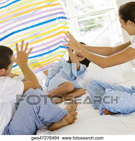 Parents playing with their daughter View Large Photo Image Picture - Parents playing with their daughter. Fotosearch