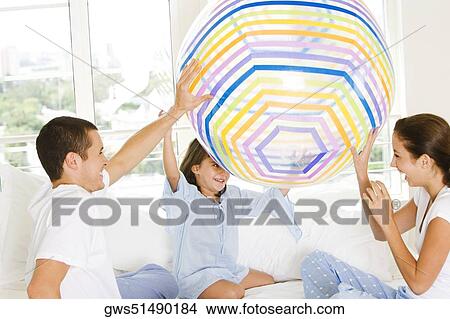 Parents playing with their daughter View Large Photo Image Picture - Parents playing with their daughter. Fotosearch