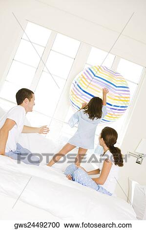 Parents playing with their daughter View Large Photo Image Stock Image - Parents playing with their daughter. Fotosearch
