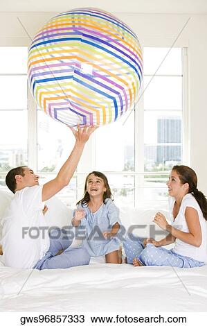 Parents playing with their daughter View Large Photo Image Stock Image - Parents playing with their daughter. Fotosearch