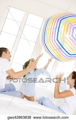 Parents playing with their daughter View Large Photo Image Stock Photo - Parents playing with their daughter. Fotosearch