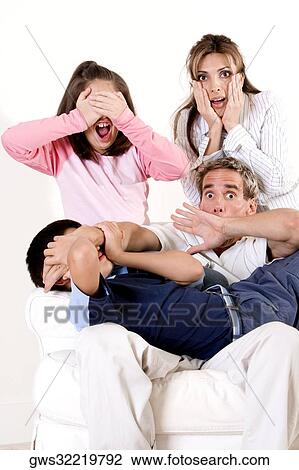 Parents with their son and daughter watching television in shock View Large Photo Image Stock Image - Parents with their son and daughter watching television in shock. Fotosearch