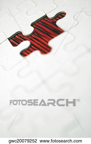 Stock Image - Piece missing from a jigsaw puzzle. Fotosearch