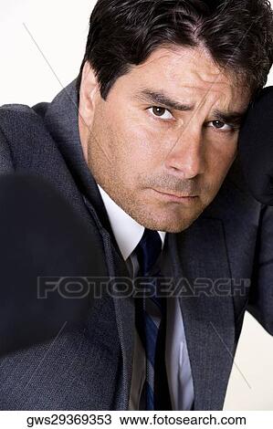Portrait of a businessman looking serious View Large Photo Image Stock Image - Portrait of a businessman looking serious. Fotosearch