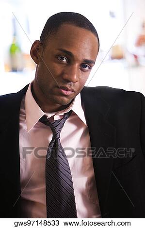 Portrait of a businessman looking serious View Large Photo Image Stock Image - Portrait of a businessman looking serious. Fotosearch