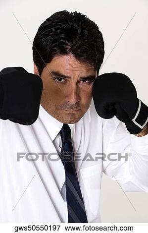 Portrait of a businessman wearing boxing gloves View Large Photo Image Stock Photo - Portrait of a businessman wearing boxing gloves. Fotosearch